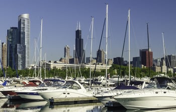 Urban marina skyline Yachts in Burnham Harbor in Chicago, Illinois, USA, with landmarks (including Willis Tower, once the tallest building in the world) in the distance, early in June